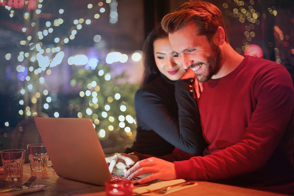 happy couple booking online